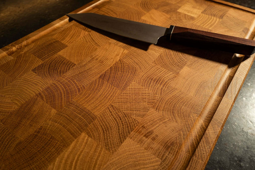 Oak end grain cutting board including cutting board stopper