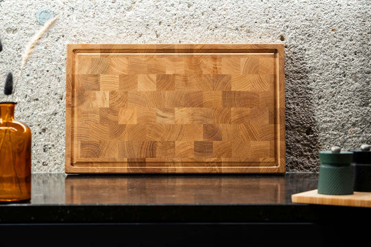 Oak end grain cutting board including cutting board stopper